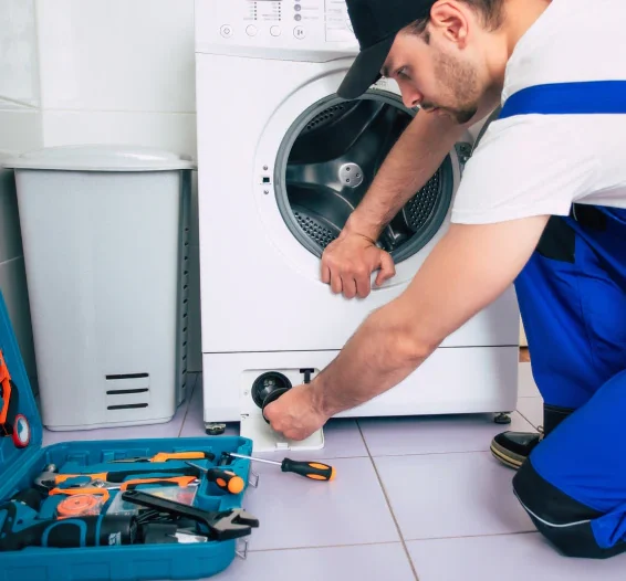 worker repairing the washer